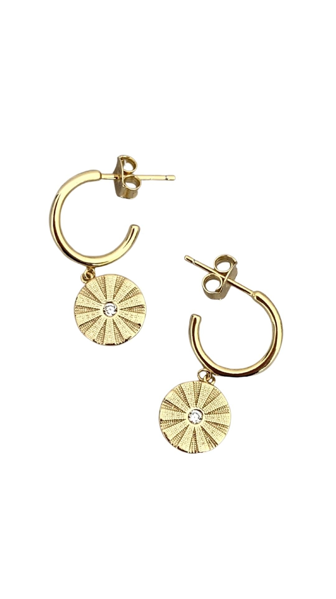 Supernova Sun Earrings Earrings Coniifer Design Studio. Coin shaped gold earrings with centre stone.